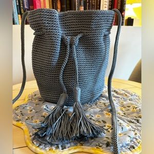 The Sak crochet baby blue drawstring crossbody with magnetic closure